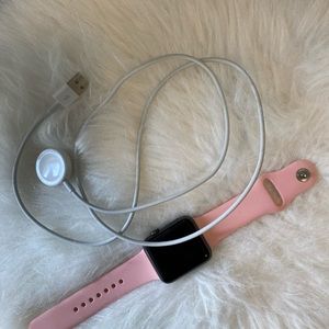 Apple Watch 1, charger and pink watch band included, no scratches